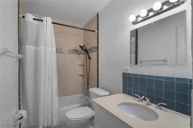 290 Granada Blvd, Fort Myers, FL 33905 - bathroom featuring vanity, toilet, backsplash, and shower / tub combo