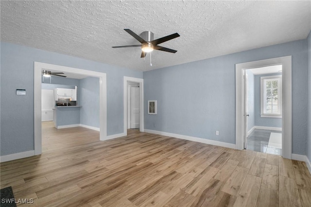 290 Granada Blvd, Fort Myers, FL 33905 - empty room with baseboards, light wood-style flooring, and ceiling fan
