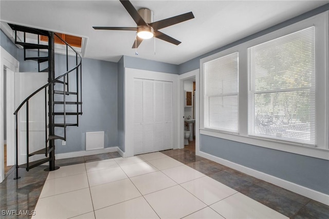290 Granada Blvd, Fort Myers, FL 33905 - tiled foyer entrance featuring baseboards, ceiling fan, and stairway