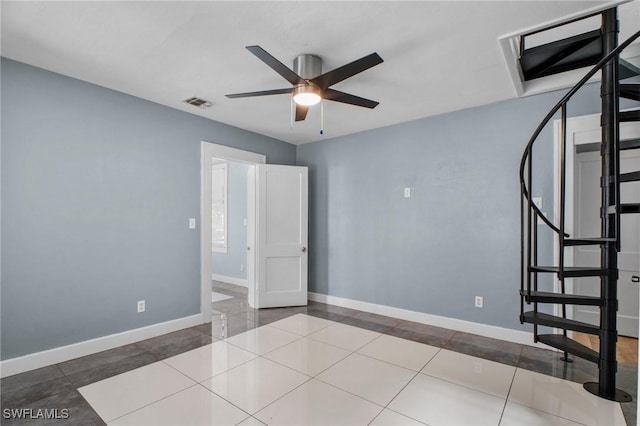 290 Granada Blvd, Fort Myers, FL 33905 - tiled empty room featuring baseboards, visible vents, stairs, and ceiling fan