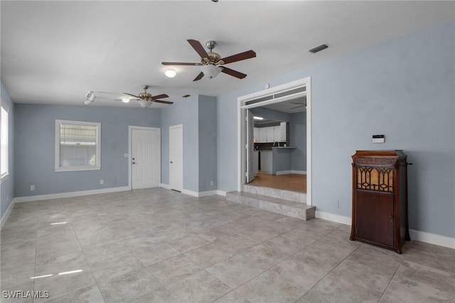 290 Granada Blvd, Fort Myers, FL 33905 - unfurnished living room featuring baseboards, visible vents, and a ceiling fan