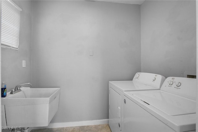 290 Granada Blvd, Fort Myers, FL 33905 - washroom featuring a sink, baseboards, washer and dryer, and laundry area