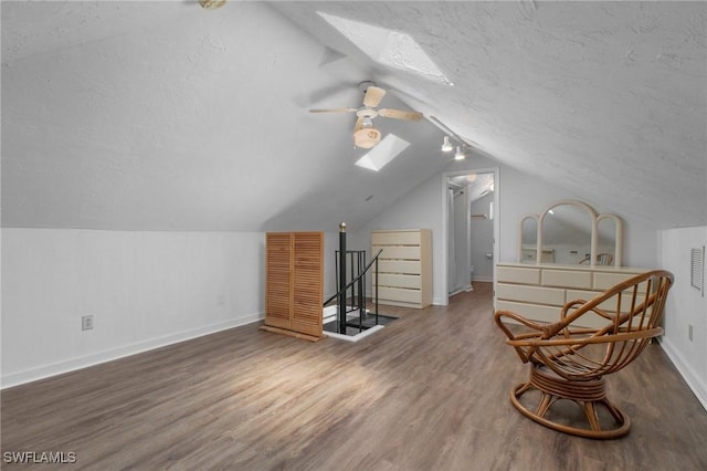 290 Granada Blvd, Fort Myers, FL 33905 - sitting room featuring baseboards, wood finished floors, an upstairs landing, and a textured ceiling