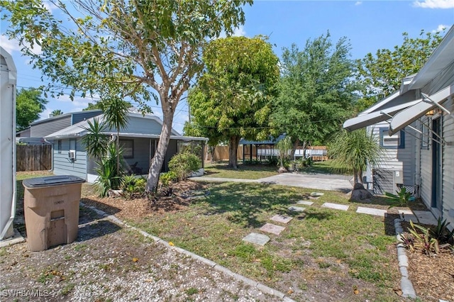 290 Granada Blvd, Fort Myers, FL 33905 - view of yard featuring an outbuilding and fence