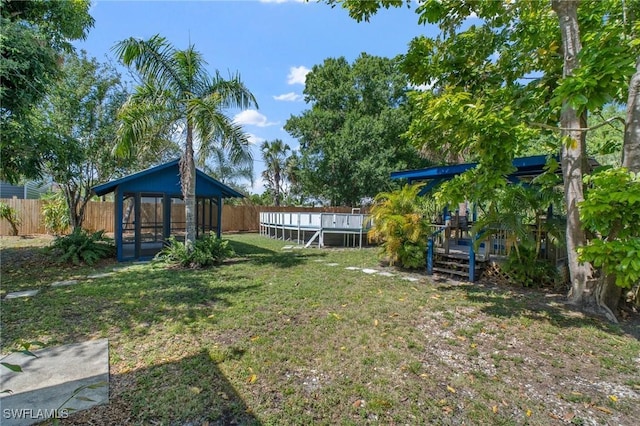 290 Granada Blvd, Fort Myers, FL 33905 - view of yard with a fenced backyard, a gazebo, a swimming pool, and a deck