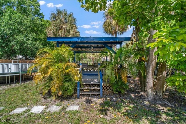 290 Granada Blvd, Fort Myers, FL 33905 - view of yard featuring a deck