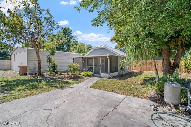 290 Granada Blvd, Fort Myers, FL 33905 - back of house with a sunroom, fence, and a yard