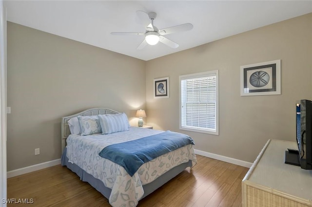 41 5th St, Bonita Springs, FL 34134 - bedroom with wood finished floors and ceiling fan
