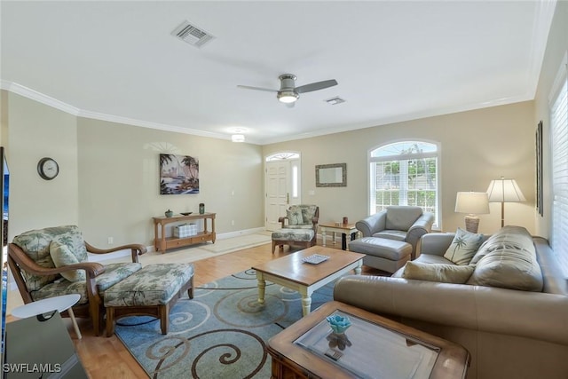 41 5th St, Bonita Springs, FL 34134 - living room featuring ornamental molding, light wood-type flooring, and a ceiling fan