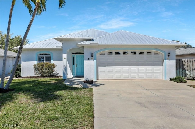 41 5th St, Bonita Springs, FL 34134 - ranch-style house with a standing seam roof, a metal roof, driveway, a garage, and stucco siding