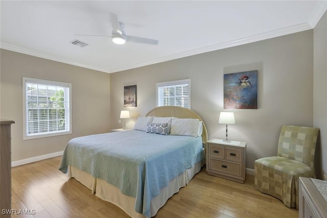 41 5th St, Bonita Springs, FL 34134 - bedroom featuring light wood-style floors, ornamental molding, and ceiling fan
