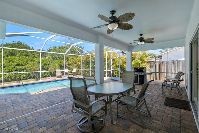 41 5th St, Bonita Springs, FL 34134 - swimming pool featuring area for grilling, a patio, a ceiling fan, and a lanai