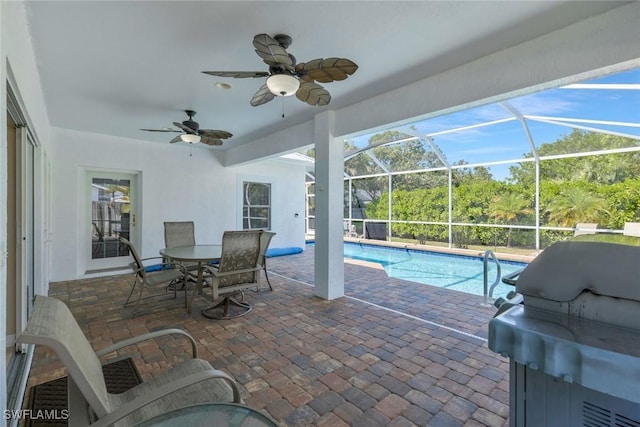 41 5th St, Bonita Springs, FL 34134 - swimming pool with a patio, grilling area, a ceiling fan, and glass enclosure
