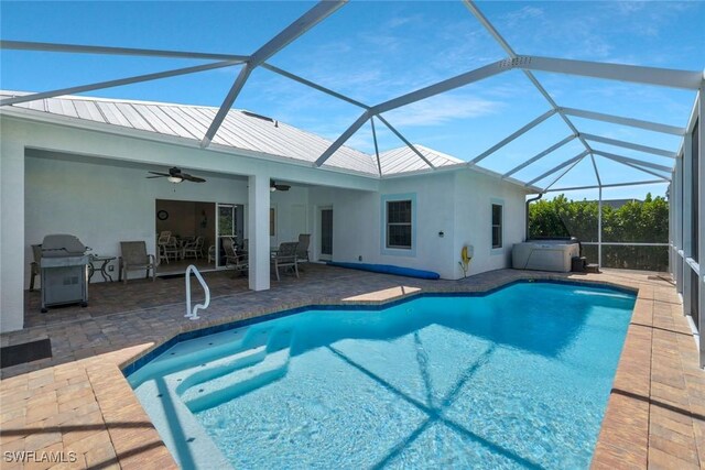 41 5th St, Bonita Springs, FL 34134 - swimming pool with a ceiling fan, a patio area, grilling area, and a hot tub