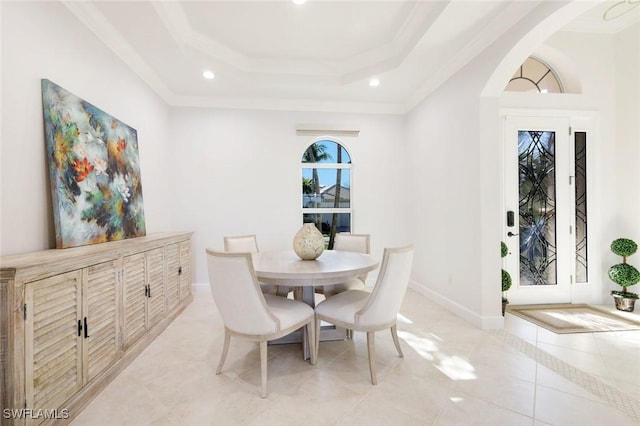 dining area with light tile patterned floors, baseboards, a raised ceiling, and recessed lighting