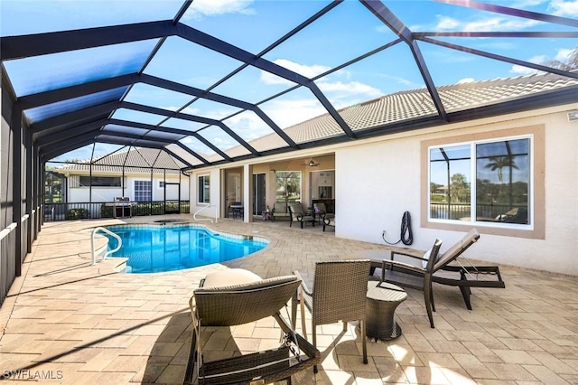 pool with a patio area and a lanai