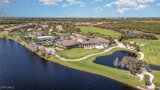 bird's eye view with a water view and view of golf course