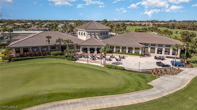exterior space featuring a patio area and view of golf course