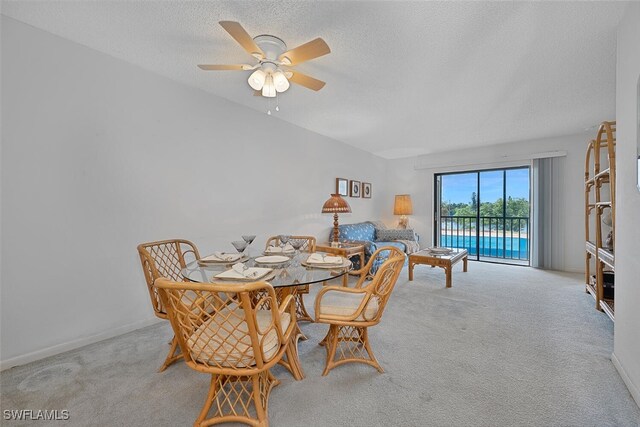 4146 27th Ct SW Unit 204, Naples, FL 34116 - dining space with carpet floors, ceiling fan, and a textured ceiling
