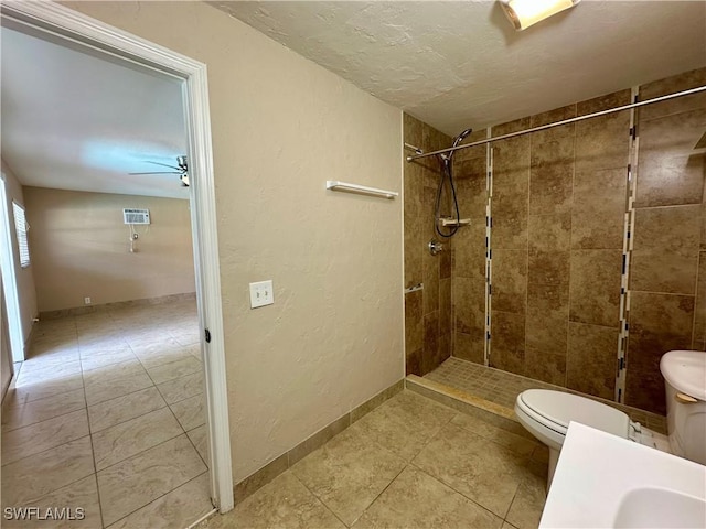 1434 Alhambra Dr, Fort Myers, FL 33901 - full bathroom with a tile shower, toilet, tile patterned flooring, ceiling fan, and a textured wall