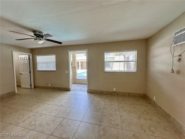 1434 Alhambra Dr, Fort Myers, FL 33901 - spare room with a wealth of natural light, baseboards, ceiling fan, and light tile patterned floors