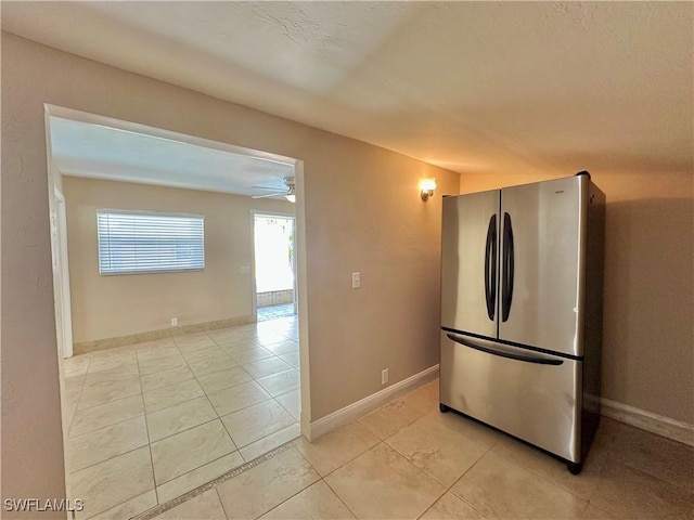 1434 Alhambra Dr, Fort Myers, FL 33901 - kitchen with ceiling fan, baseboards, freestanding refrigerator, and light tile patterned floors