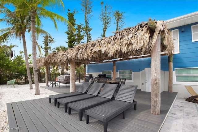 wooden terrace with fence and outdoor dining area