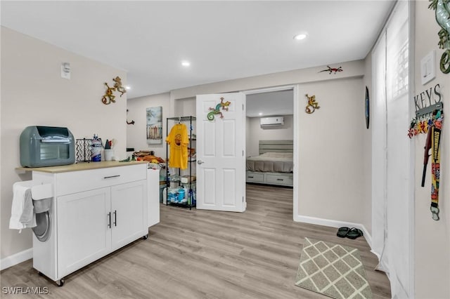kitchen featuring white cabinetry, light countertops, light wood-style floors, and recessed lighting