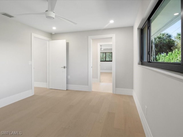 unfurnished bedroom with light wood finished floors, recessed lighting, visible vents, and baseboards