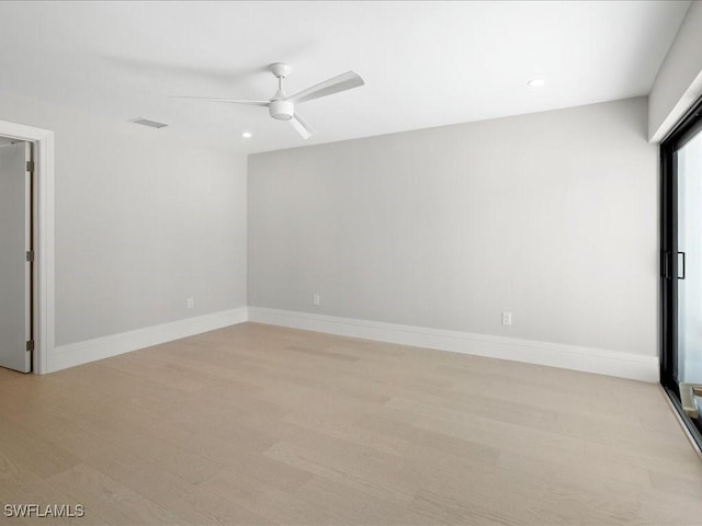 empty room with recessed lighting, a ceiling fan, visible vents, and baseboards