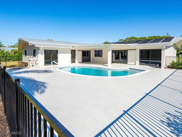 view of swimming pool with fence, a fenced in pool, and a patio area