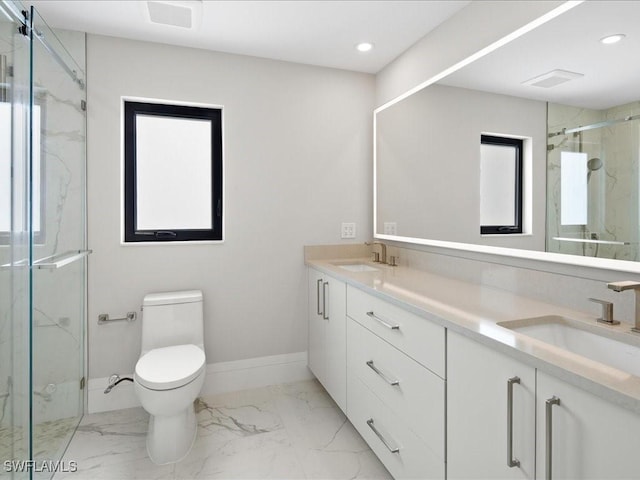 bathroom with toilet, a marble finish shower, marble finish floor, and a sink