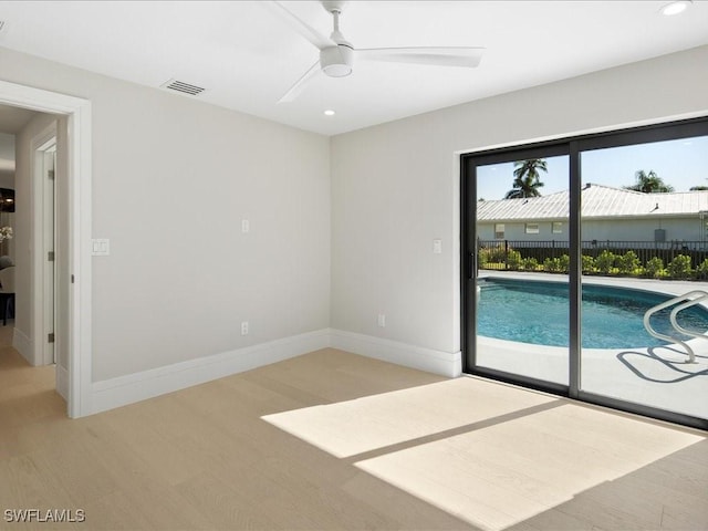 spare room with visible vents, ceiling fan, baseboards, light wood-type flooring, and recessed lighting