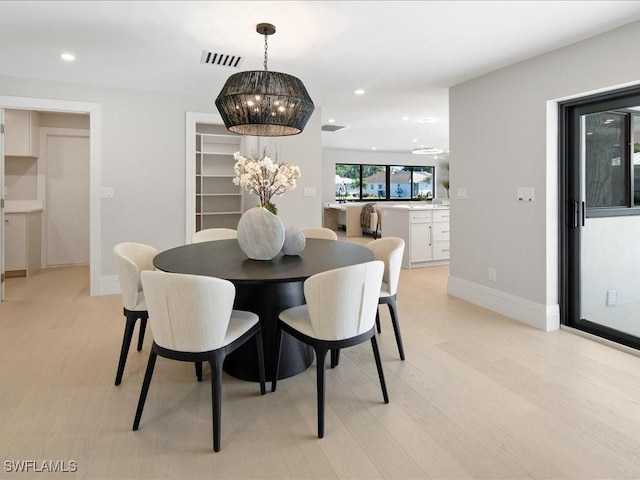 dining space with a chandelier, visible vents, light wood-style flooring, and recessed lighting