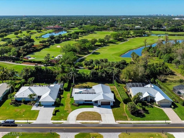 aerial view featuring a residential view, golf course view, and a water view