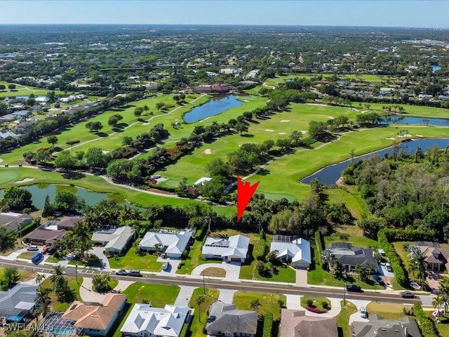 birds eye view of property featuring golf course view, a residential view, and a water view