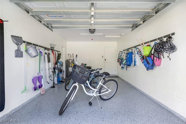 820 102nd Ave N, Naples, FL 34108 - garage with electric water heater and a garage door opener