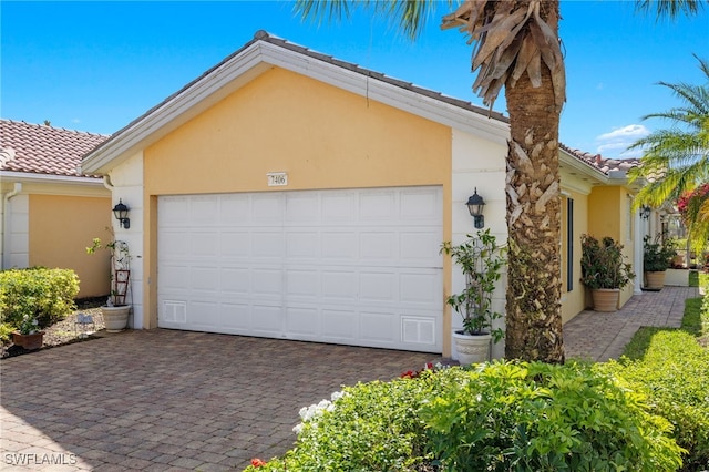 exterior space featuring decorative driveway