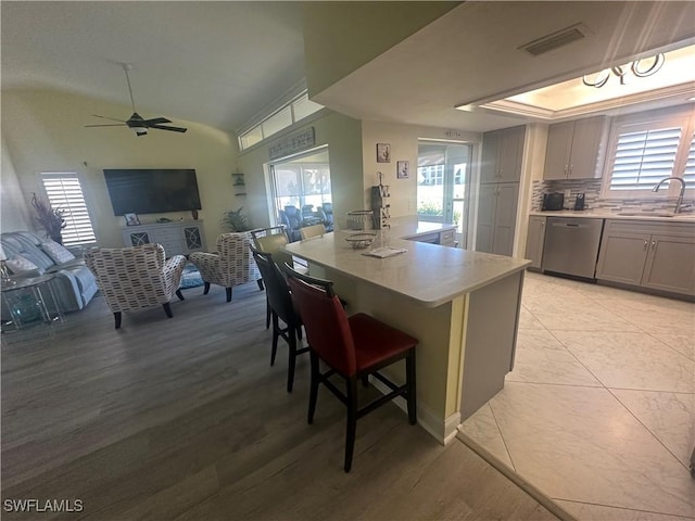 kitchen with visible vents, a sink, dishwasher, and a healthy amount of sunlight