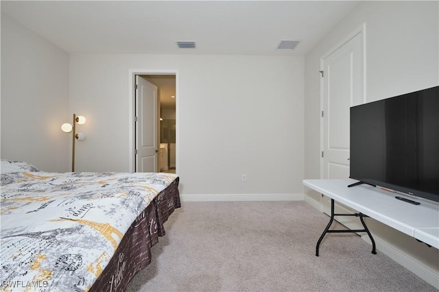 carpeted bedroom featuring visible vents and baseboards
