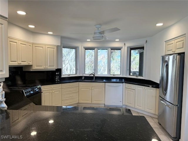 484 Gulf Bend Dr, Captiva, FL 33924 - kitchen featuring dishwasher, freestanding refrigerator, electric range, a ceiling fan, and a sink