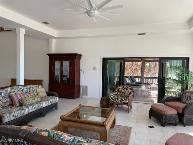 484 Gulf Bend Dr, Captiva, FL 33924 - living room with tile patterned floors, visible vents, a ceiling fan, and decorative columns