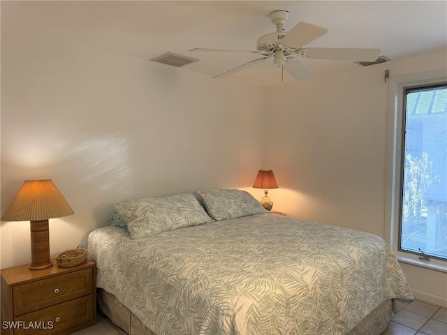 484 Gulf Bend Dr, Captiva, FL 33924 - bedroom with light tile patterned floors, visible vents, and ceiling fan