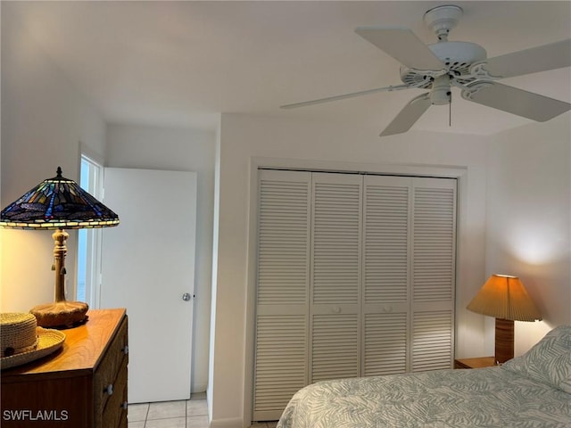 484 Gulf Bend Dr, Captiva, FL 33924 - bedroom with light tile patterned floors, a closet, and ceiling fan