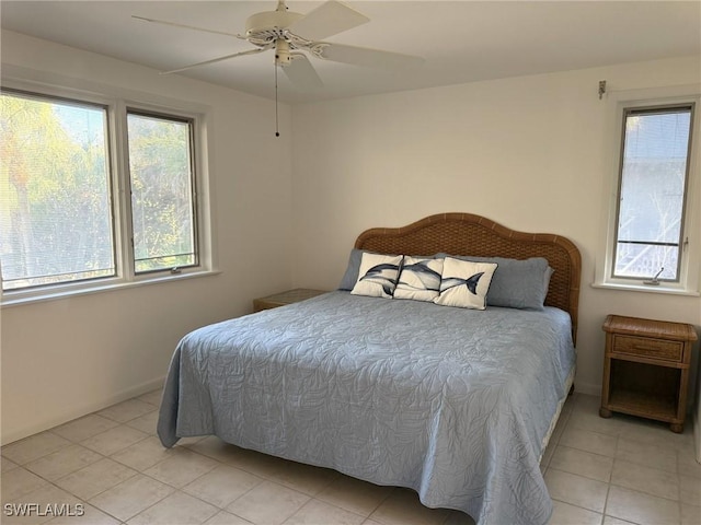 484 Gulf Bend Dr, Captiva, FL 33924 - bedroom with light tile patterned floors and a ceiling fan