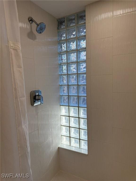484 Gulf Bend Dr, Captiva, FL 33924 - full bathroom featuring tiled shower