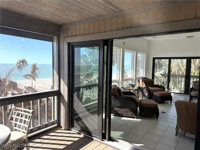 484 Gulf Bend Dr, Captiva, FL 33924 - sunroom / solarium featuring tile patterned floors and wooden ceiling