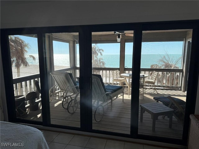 484 Gulf Bend Dr, Captiva, FL 33924 - entryway with a healthy amount of sunlight, radiator heating unit, a ceiling fan, and a water view