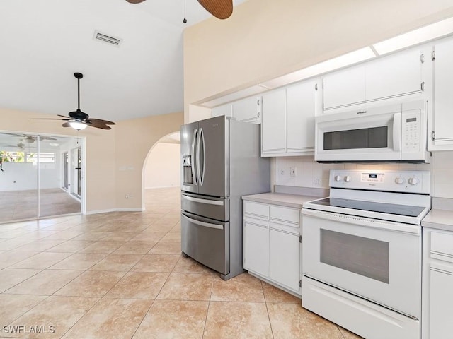 4538 SE 6th Ct, Cape Coral, FL 33904 - kitchen featuring a ceiling fan, tasteful backsplash, arched walkways, white appliances, and light countertops