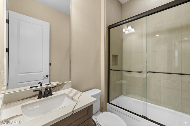 7282 Saona Ct, Naples, FL 34113 - bathroom featuring toilet, vanity, and bath / shower combo with glass door